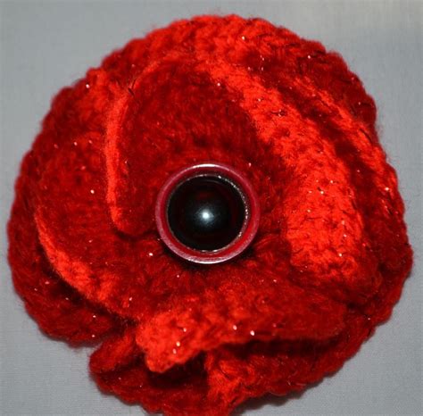 Crochet Poppy Brooch Crochet pattern by Catherine Drabble | Knitting Patterns | LoveKnitting