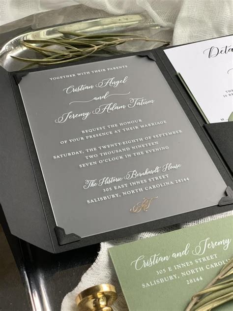 the wedding stationery is laid out on top of each other and ready for guests to arrive