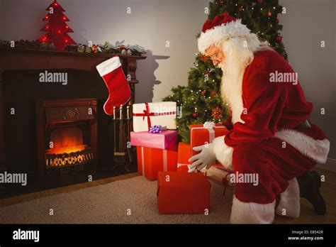 Santa claus delivering gifts hi-res stock photography and images - Alamy