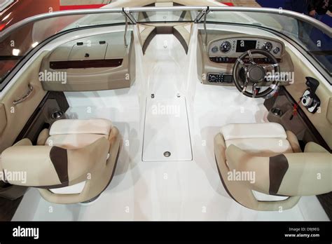 Interior of a modern speed boat - leather seats, plastic floor, driving components Stock Photo ...