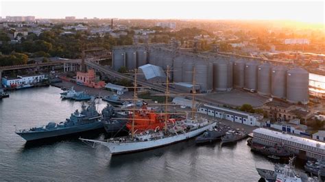 Premium Photo | Aerial drone view of odessa sea port ships militaryindustrial port at evening sunset