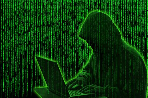 Conceptual image of a hacker on green matrix background » Fischblog ...