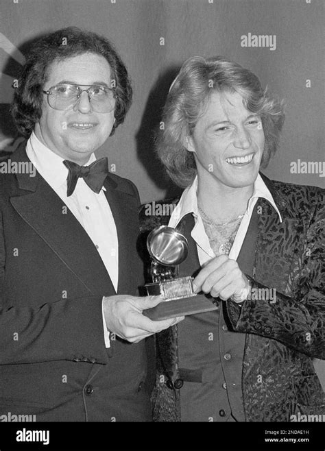 Record producer Phil Ramone and singer Andy Gibb smile at the Grammy ...