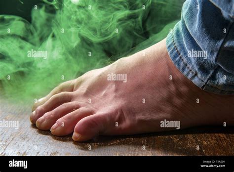 Male smelly foot with colorful visible odor vapor Stock Photo - Alamy