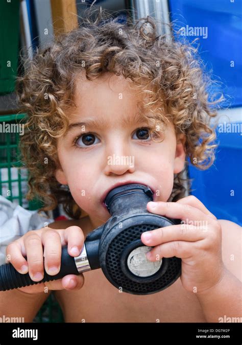 Young boy with a scuba diving mouthpiece in his mouth Model release Stock Photo: 61638942 - Alamy