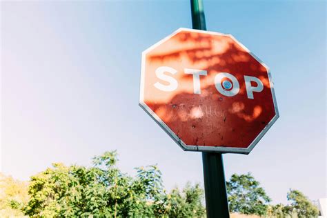 Red Stop Signage Under Clear Blue Sky · Free Stock Photo