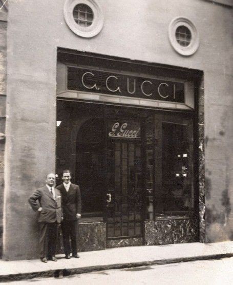 Guccio Gucci and son Rodolfo outside the original store in 1940s ...