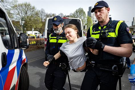 Greta Thunberg arrested by Dutch police twice on same day during Hague protests | The Independent