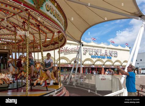 Family traditional carousel on pier promenade park parks garden hi-res ...