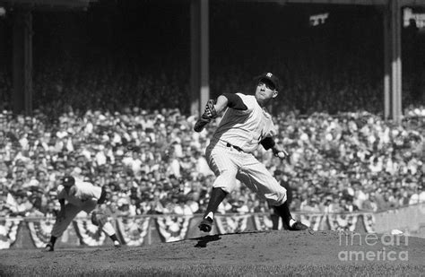 Whitey Ford Pitching Against Milwaukee by Bettmann