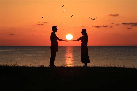 Silhouette of a couple at sunset 1864639 Stock Photo at Vecteezy