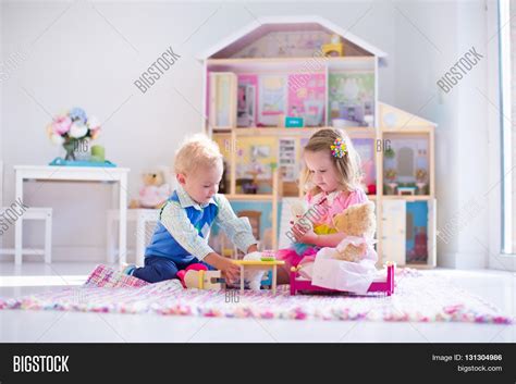 Kids Playing Doll Image & Photo (Free Trial) | Bigstock