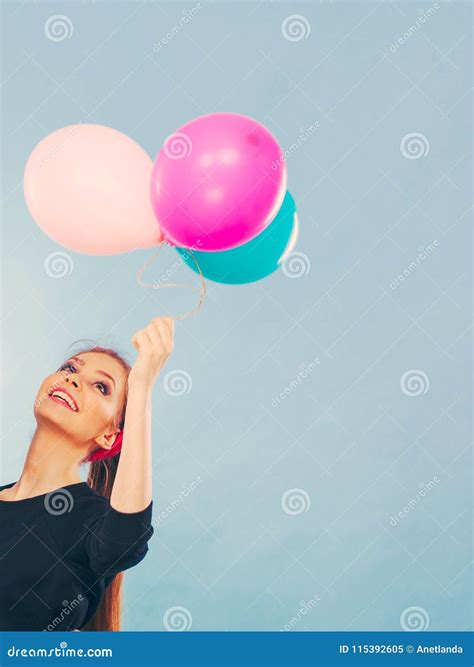 Lovely Smiling Girl Holds Colorful Balloons. Stock Image - Image of smile, balloons: 115392605