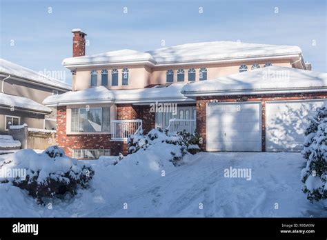 Big residential house in snow on winter season in Canada Stock Photo ...