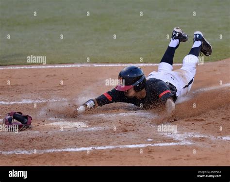 Maryland's LaMonte Wade scores on a fourth inning 2 RBI single by Blake ...