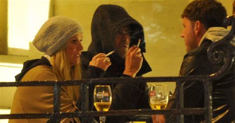 Jurgen Klopp pictured enjoying a beer and a cigarette with his family on night out in Liverpool ...