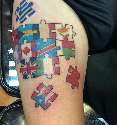 Tattoo with flags from different countries in puzzle pieces. Good tattoo for traveling. Add a ...