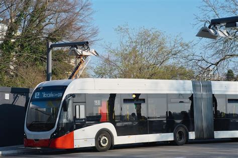 Premium Photo | A large electric bus charging at a charging station