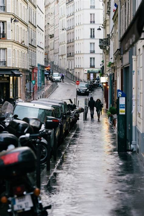 Streets of Paris in the Rain Stock Photo - Image of back, everyday ...