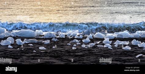 Sunrise on Diamond Beach, Iceland. The black volcanic sands are ...