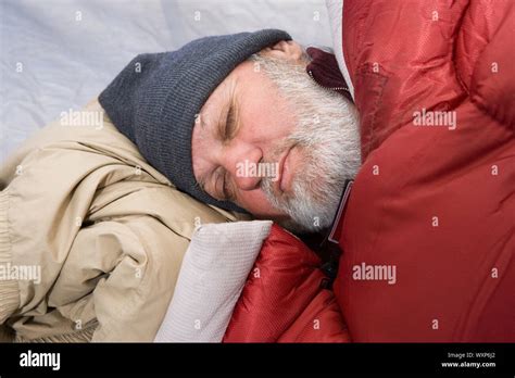 Senior man sleeping in a tent Stock Photo - Alamy