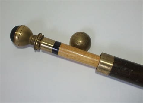 vintage brass and wood pool cue