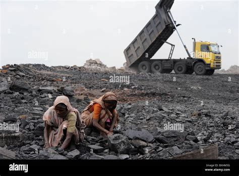 India Jharkhand Dhanbad Jharia, people pick coal at overburden dumping ...