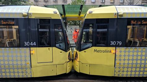 Major disruption after two Metrolink trams crash in Manchester - BBC News