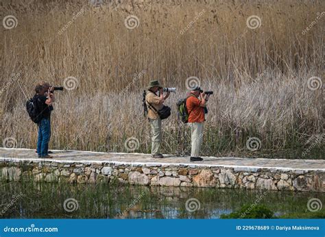 Photographers On Prespa Lake Photographing Birds With Telephoto Lenses | CartoonDealer.com ...