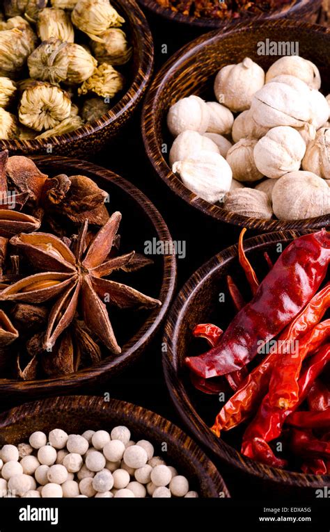 Thai spices in small wooden bowls Stock Photo - Alamy