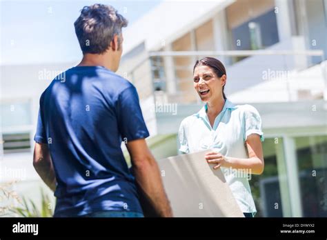 Family in big house Stock Photo - Alamy