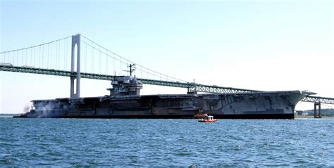 USS Forrestal (CV-59) is towed under the Delaware Memorial Bridge for scrapping in Texas, 4 ...