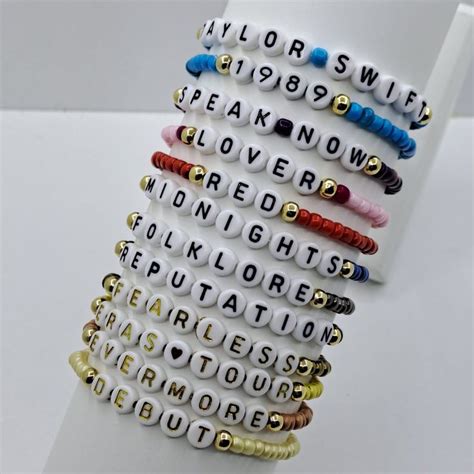 several bracelets with words written on them