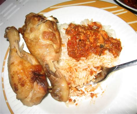 Rice And Fish Stew Served With Juicy Chicken Drumsticks