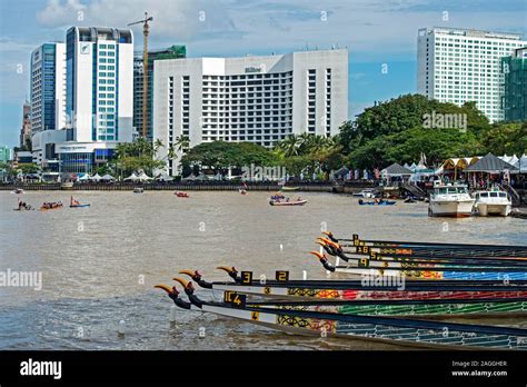 Kuching Waterfront at Sarawak river with traditional boats and Hotel buildings, Kuching, Sarawak ...