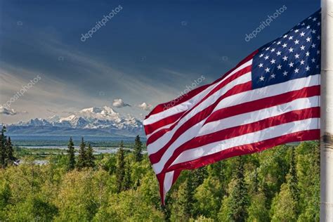 Usa American flag stars and stripes on mount McKinley Alaska background ...