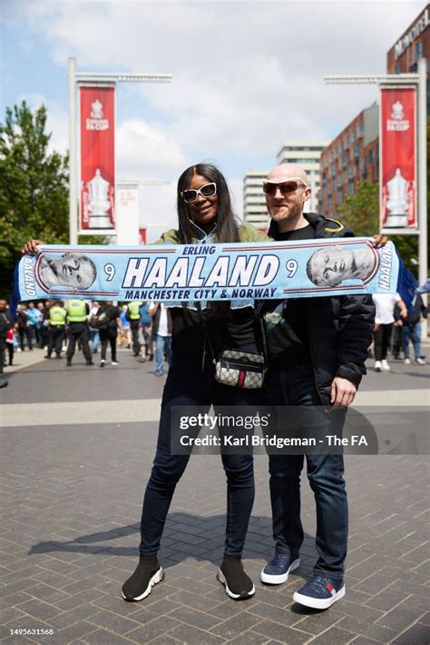 Two Manchester City fans poses for a photo outside the stadium prior ...