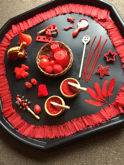 a black tray with red decorations on it