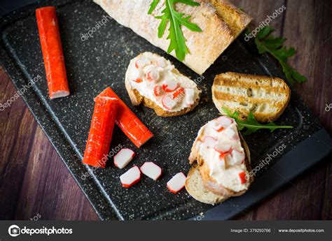 Cheese sandwich and crab sticks on top Stock Photo by ©Rawlik 379293766