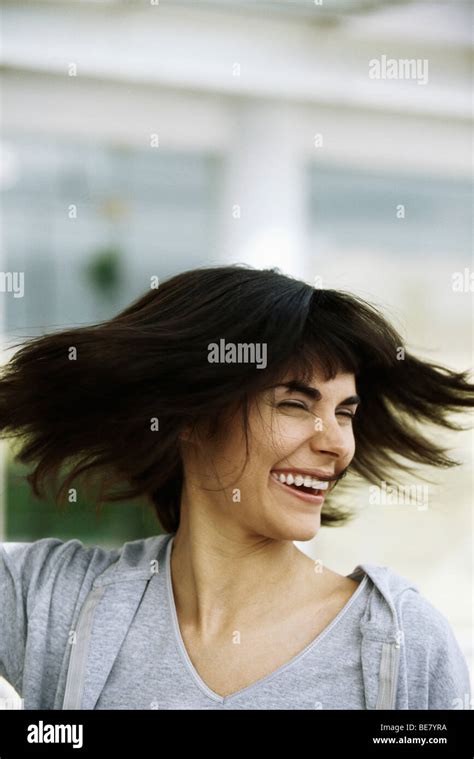 Woman tossing hair, portrait Stock Photo - Alamy