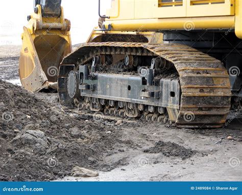 Backhoe Track and Bucket stock photo. Image of yellow - 2489084