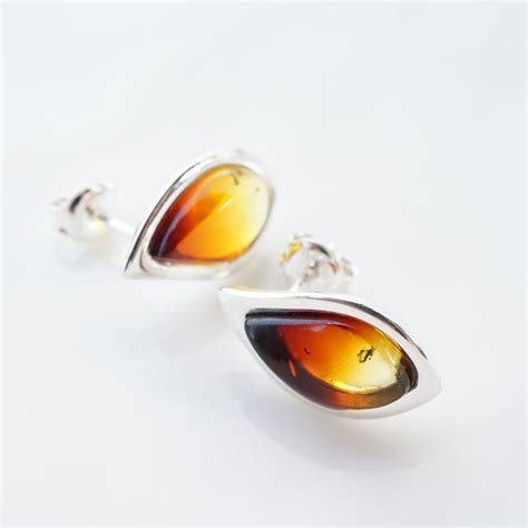 Elegant Tear Drop Burning Amber Stud Earring | Premium heat … | Flickr