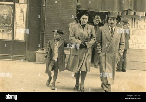 Family crossing the street, Italy Stock Photo - Alamy