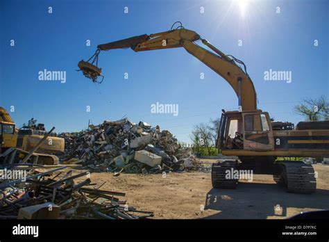 Crane With Magnet Picking Up Scrap Metal For Recycling In Junk Yard Stock Photo, Royalty Free ...