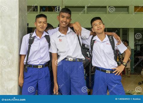 Three Thai Students in Their School Uniform is Standing by and Embracing Each Other in Front of ...