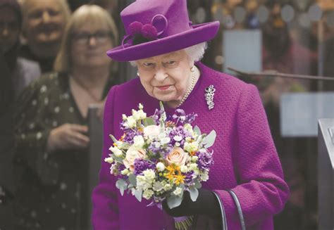 Queen Elizabeth II received flowers as she leaves after the officially ...