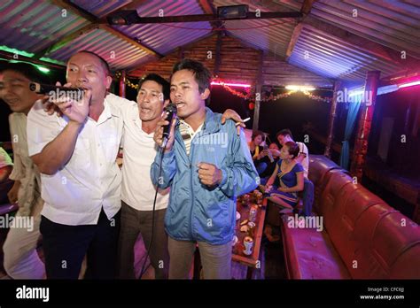 Men singing karaoke on a boat, Halong Bay, Quang Ninh, Vietnam Stock ...