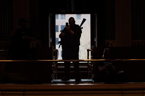 Michigan militia’s march on state house puts armed protest in the spotlight