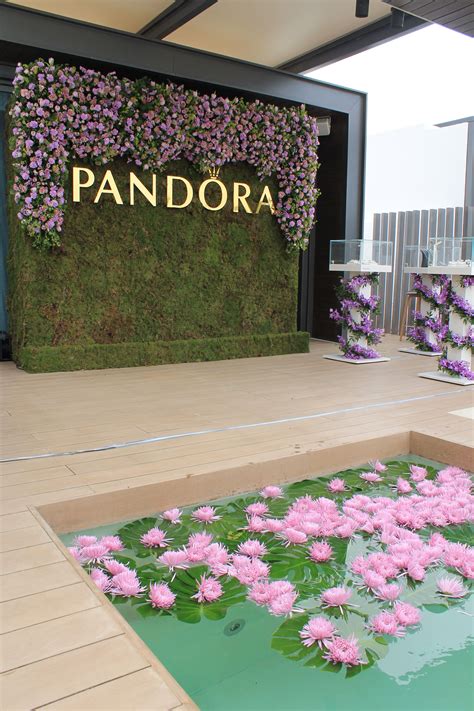 Beautiful flower wall and styling produced and designed by Carousel Events Dubai, for Pandora ...