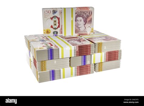 pile piles of UK money stack stacks of british polymer £50 notes bundle ...